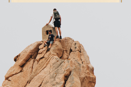 Taking risk - two people mountain climbing